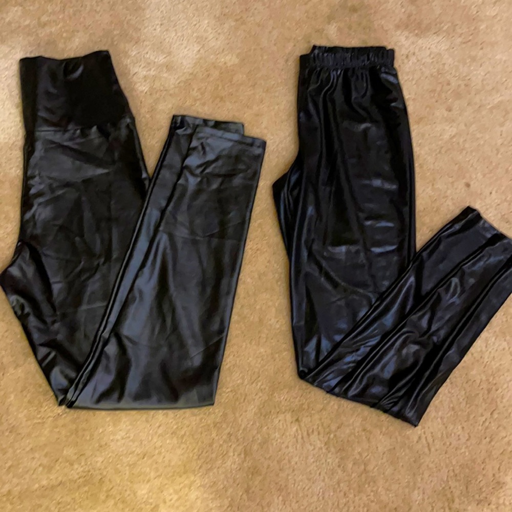 Two pair of faux leather leggings.